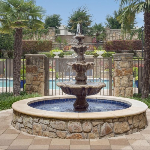 The essence of exceptional living a fountain in a courtyard