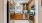 a kitchen with wooden cabinets