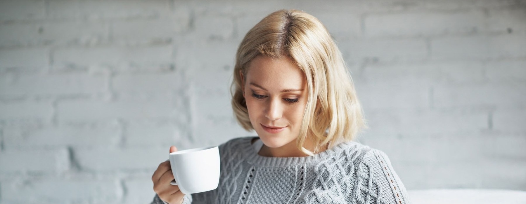 a woman drinking coffee
