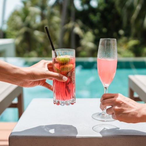 Settle into comfort at Estancia Townhomes a couple of drinks on a table