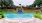 a pool with a blue sign