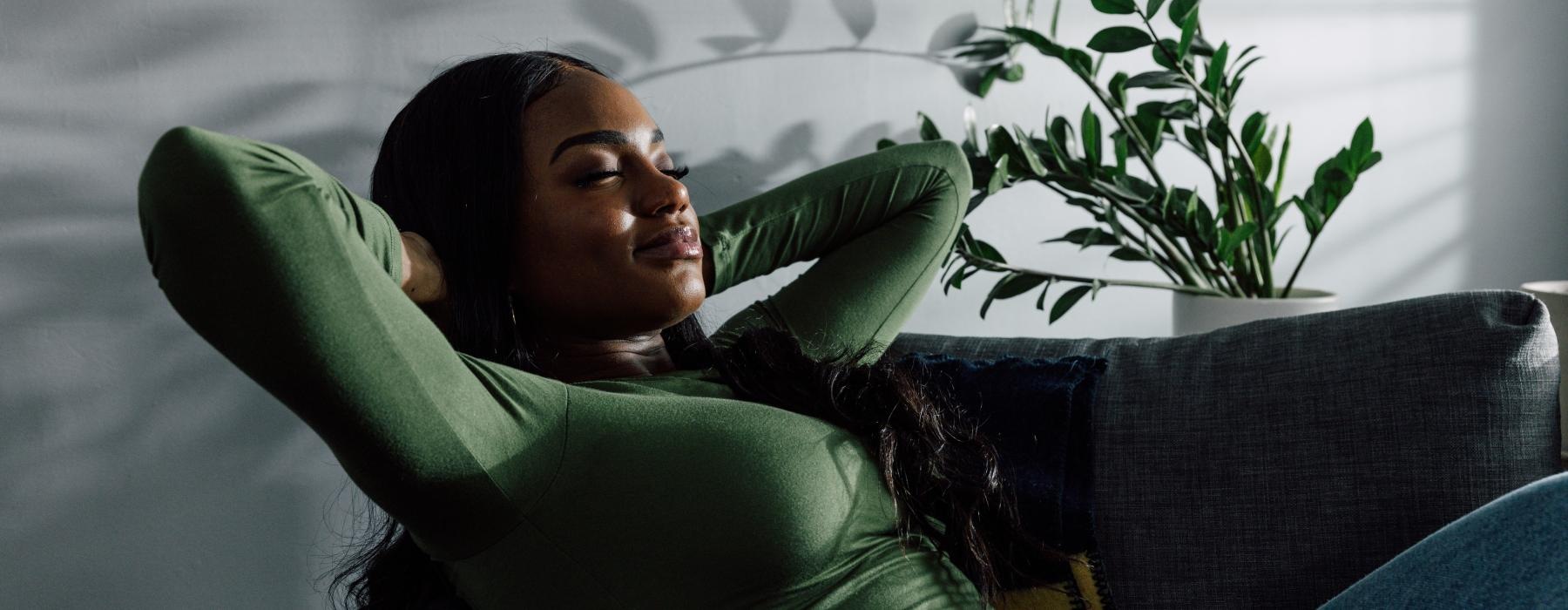 a woman sleeping on a couch