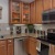 a kitchen with wooden cabinets