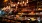 a bar with many bottles of alcohol